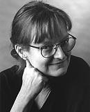 A black and white image of a white woman smiling