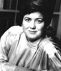 A black and white image of a white woman smiling